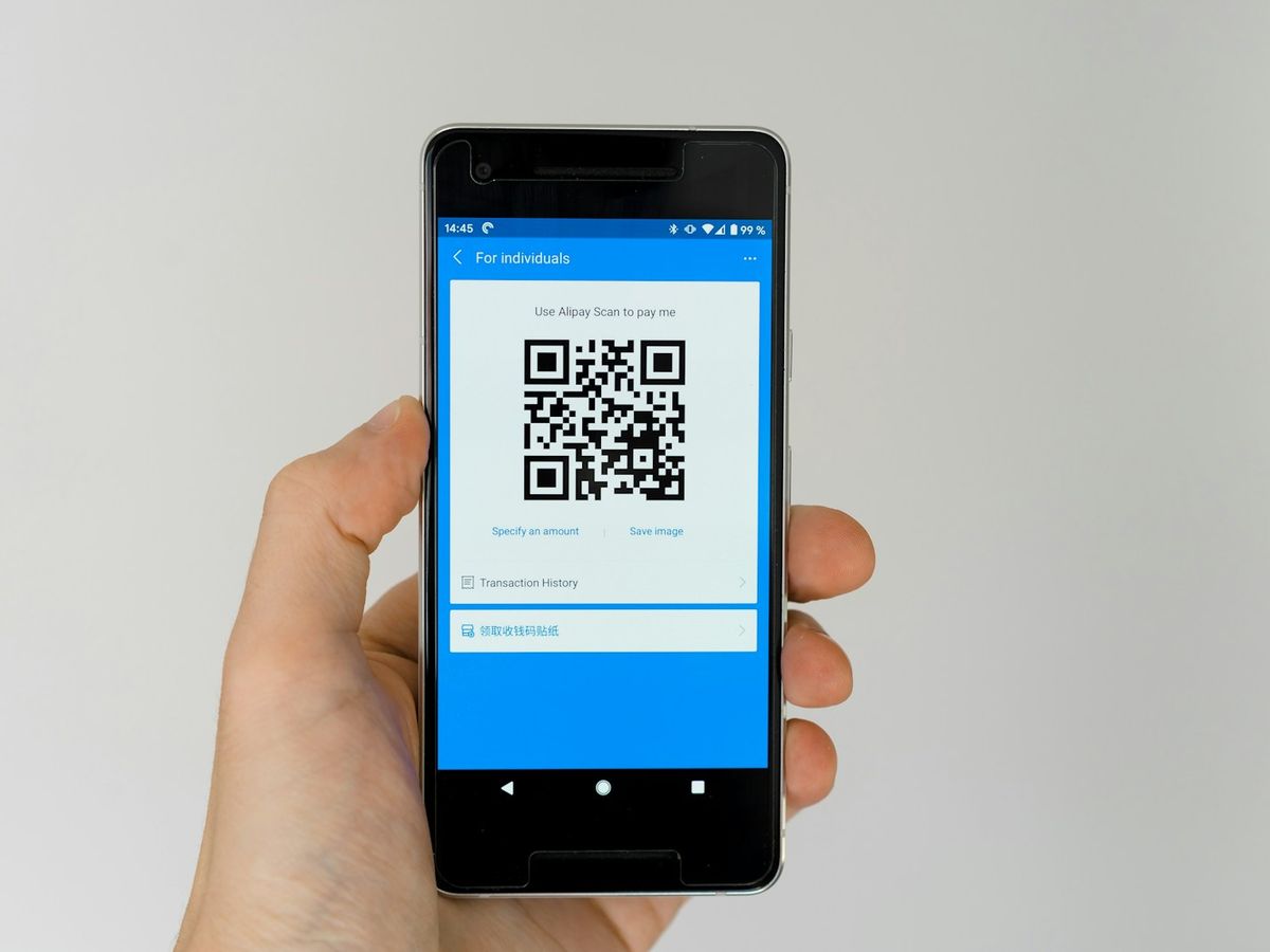 A phone showing the QR code to join a game