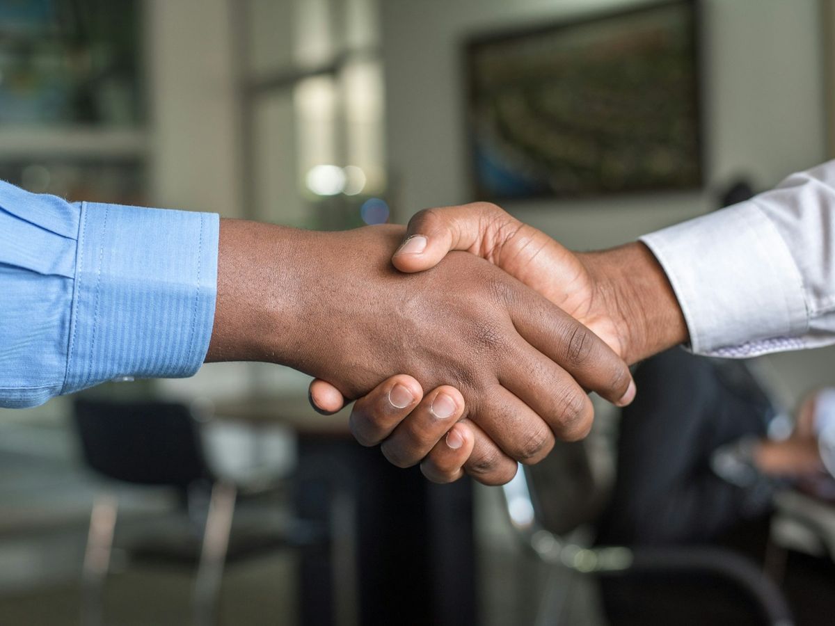 Two business partners shaking hands